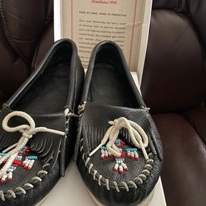 Minnetonka navy moccasins beaded toe.